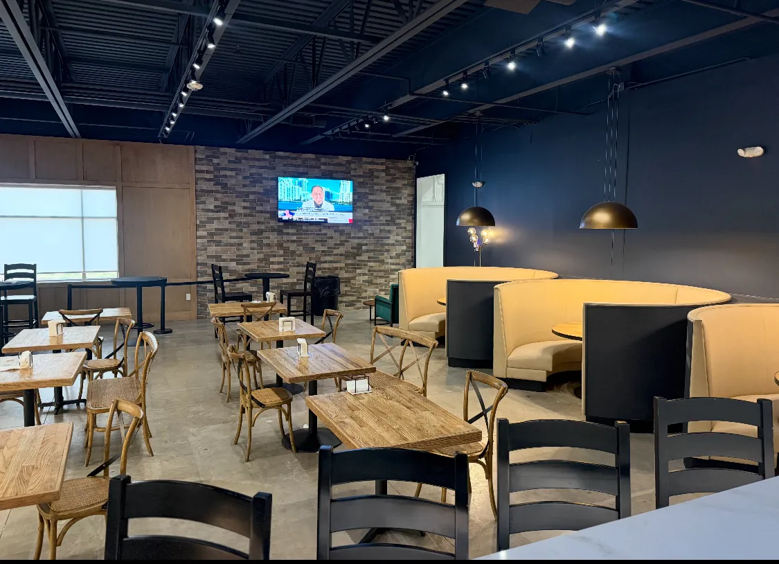 Booths and wooden tables in the Areté Café