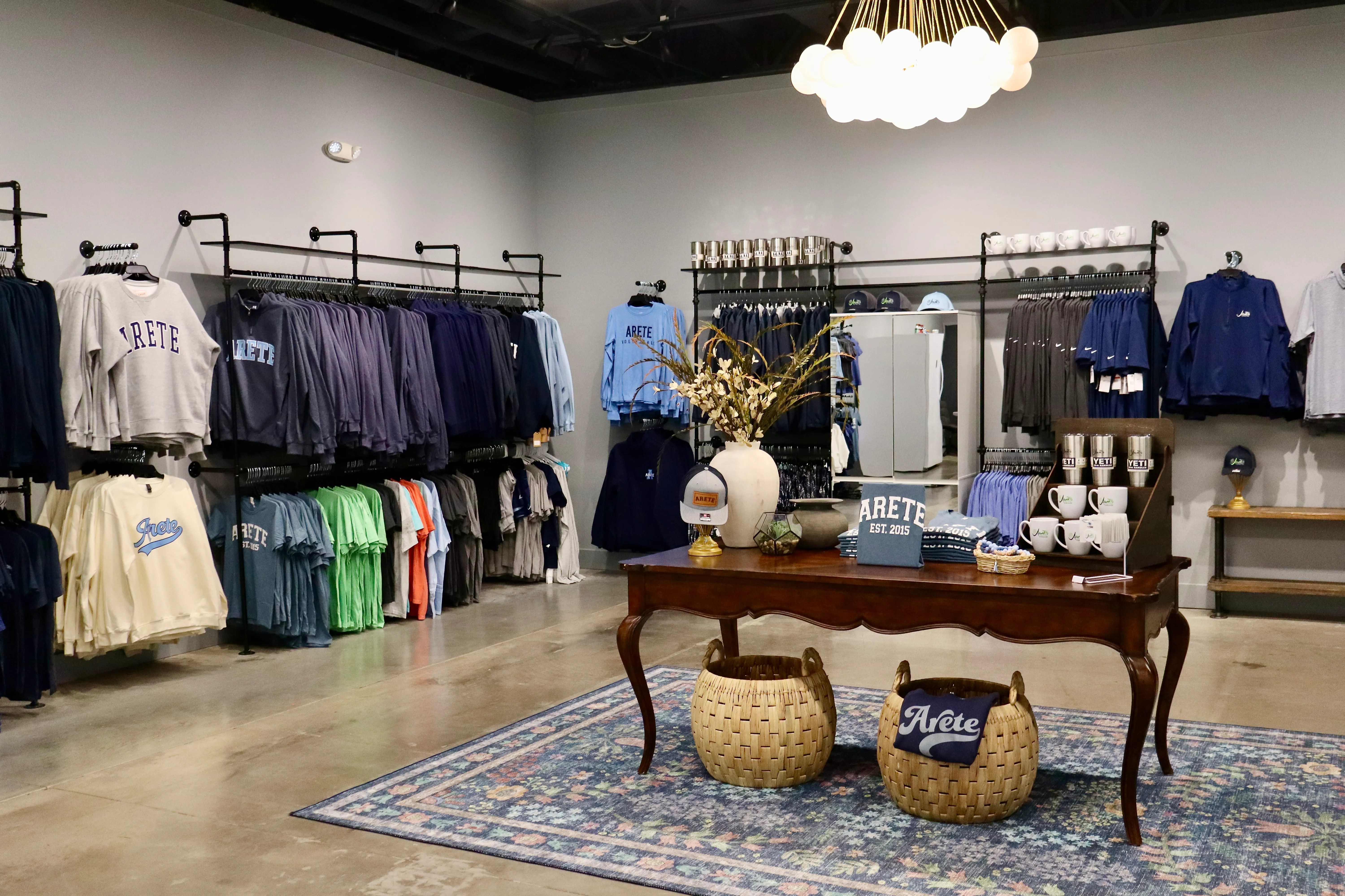 Areté apparel, hats and drinkware in the pro shop